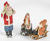 Three composition Santa Claus figures