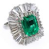 Approx.. 4.25 Carat Colombian Emerald, 5.0 Carat Tapered Baguette and Round Brilliant Cut Diamond and Platinum Ballerina Ring