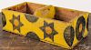 Painted pine carrier, 20th c., made from a shipping crate, with star and moon decoration on a yellow
