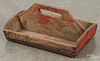 Painted pine utensil carrier, 19th c., retaining an old red surface, 6'' h., 14 3/4'' w.