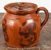 Pennsylvania redware covered pitcher, 19th c., with manganese splotching, 6'' h.