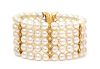 An 18 Karat Yellow Gold, Diamond and Cultured Pearl Flexible Cuff Bracelet, 56.10 dwts.