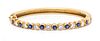 An 18 Karat Yellow Gold, Sapphire and Diamond Bangle Bracelet, 17.20 dwts