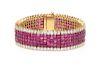 An 18 Karat Yellow Gold, Ruby and Diamond Invisible Set Bracelet, 42.80 dwts.