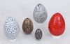 THREE SPECKLED GLASS EGGS AND TWO FEATHERED EGGS