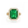 An Emerald and Diamond Halo Ring