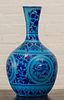BLUE-GLAZED BOTTLE VASE DECORATED IN THE PERSIAN TASTE