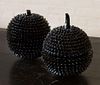 TWO BLACK LACQUERED SPIKED-FRUIT FORM BOXES AND COVERS