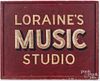 Painted trade sign for Loraine's Music Studio