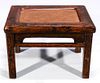 AN ANTIQUE CHINESE ELM STOOL WITH RATTAN