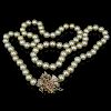 Vintage Single Strand White Pearl Necklace with 14 Karat Yellow Gold Clasp accented with Diamonds and Rubies.