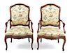 * A Pair of Louis XV Walnut Fauteuils Height 41 1/2 inches.