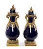 * A Pair of Sevres Style Gilt Bronze Mounted Porcelain Vases Height of taller 29 inches.