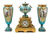 * An Assembled French Gilt Bronze Mounted Porcelain Clock Garniture Height of clock 16 1/2 inches, height of vases 14 3/4 inc