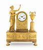 An Empire Gilt Bronze Figural Mantel Clock Height 16 3/8 x width 11 7/8 inches.
