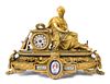 A Napoleon III Porcelain Mounted Gilt Bronze Figural Mantel Clock Height 17 x width 24 3/4 x depth 9 inches.