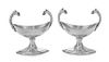 * A Pair of German Silver Salts, Maker's Mark Schott, 19th Century, the twin handles worked to show animal masks, raised on a