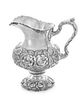 * An American Silver Water Pitcher, The Stieff Company, Baltimore, MD, the baluster form body with repousse floral and foliat