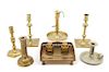 A Collection of Brass Candlesticks Height of tallest 8 1/2 inches.