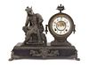An American Cast Metal Figural Mantel Clock Height 13 3/4 inches.
