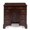 A George III Mahogany Kneehole Desk Height 31 1/4 x width 32 x depth 19 1/4 inches.