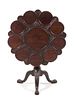 A Chippendale Style Mahogany Tilt-Top Supper Table Height 28 x diameter of top 33 1/4 inches.