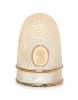 * A French Palais Royal Mother-of-Pearl Thimble, Late 18th/Early 19th Century, the domed body with an applied gilt metal oval