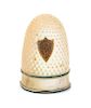 * A French Palais Royal Mother-of-Pearl Thimble, 19th Century, the domed body with an applied shield form gilt metal cartouch