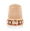 * An American 14-Karat Rose Gold and Pearl Thimble, Simons Bros., Philadelphia, PA, the knurled top and body above a pearl in