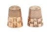 * Two American Gold Thimbles, , each having a knurled top and body above a paneled base, each with foliate and geometric moti