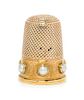 * A Yellow Gold and Pearl Inset Thimble, , the knurled top and diapered body above a plain band with engraved initials spaced