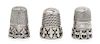 * A Group of Three Silver Thimbles, Various Makers, each having a knurled top and body above a band worked to show fleurs-de-