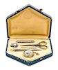 * An Art Deco Silvered Metal Sewing Kit, , fitted with a needle case, bodkin, thimble, scissors, stiletto and tape measure.
