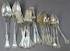Sterling silver flatware lot to include 12 teaspoons, 10 forks, and 2 serving spoons, 24 total pieces. 
23.9 troy ounces