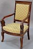 Continental mahogany armchair on sabre style carved leg, early 19th century.