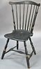 Windsor fanback side chair on bold turned legs in black paint over old green paint.  ht. 36in., seat ht. 17 1/4in. Provenance