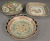 Three piece Famille Rose lot including square dish, shaped dish, and scalloped dish (scalloped dish with two chips). 
square: