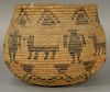 Coiled Indian basket with dog and man figures decoration.
ht. 5 1/2in., opening dia. 5 1/2in.