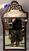 Chinese hardwood mirror having hand painted panel at top. 
ht. 38in., wd. 21in.
