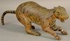 Carved Folk Art cat, hand painted tiger stripes, wire whiskers, and long carved tail (paw and tail repaired).  ht. 4 1/2in., 