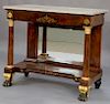 American Classical ormolu mounted and figured mahogany marble topped pier table, frieze with brass inlays, bronze mounted col