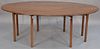 Mahogany Wake style table having oval drop leaves, all set on squared legs. 
ht. 29in.
top closed: 16" x 83" 
top open: 53 1/