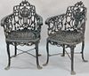 Pair of Victorian iron chairs with lyre type backs. 
ht. 32in., wd. 21 1/4in.