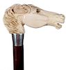 64. Mammoth Horse Dress Cane-20th Century- A large thick carving in mammoth ivory of a horse with two color glass eyes and fu