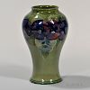 Moorcroft Pansy Vase, England, c. 1925, green ground with enameled flowers, signed and impressed mark, ht. 9 in.