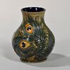 Moorcroft Peacock Feather Vase England, c. 1996, stylized feathers in color and set to a pale green ground, signed and impres