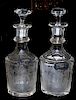 A pair of etched glass bourbon and scotch decanters late 19th century, both etched elk in the forest, silver plated identity 