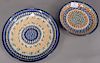Setting for twelve, handmade Polish pottery dinner and luncheon plates, hand painted and marked Made in Poland, most signed, 