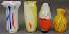 Group of four art glass Murano vases including yellow with orange splash, red and white ground with black, yellow, and white 