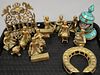 Tray lot to include a group of heavy cast brass figures playing musical instruments, oil lamp, etc.